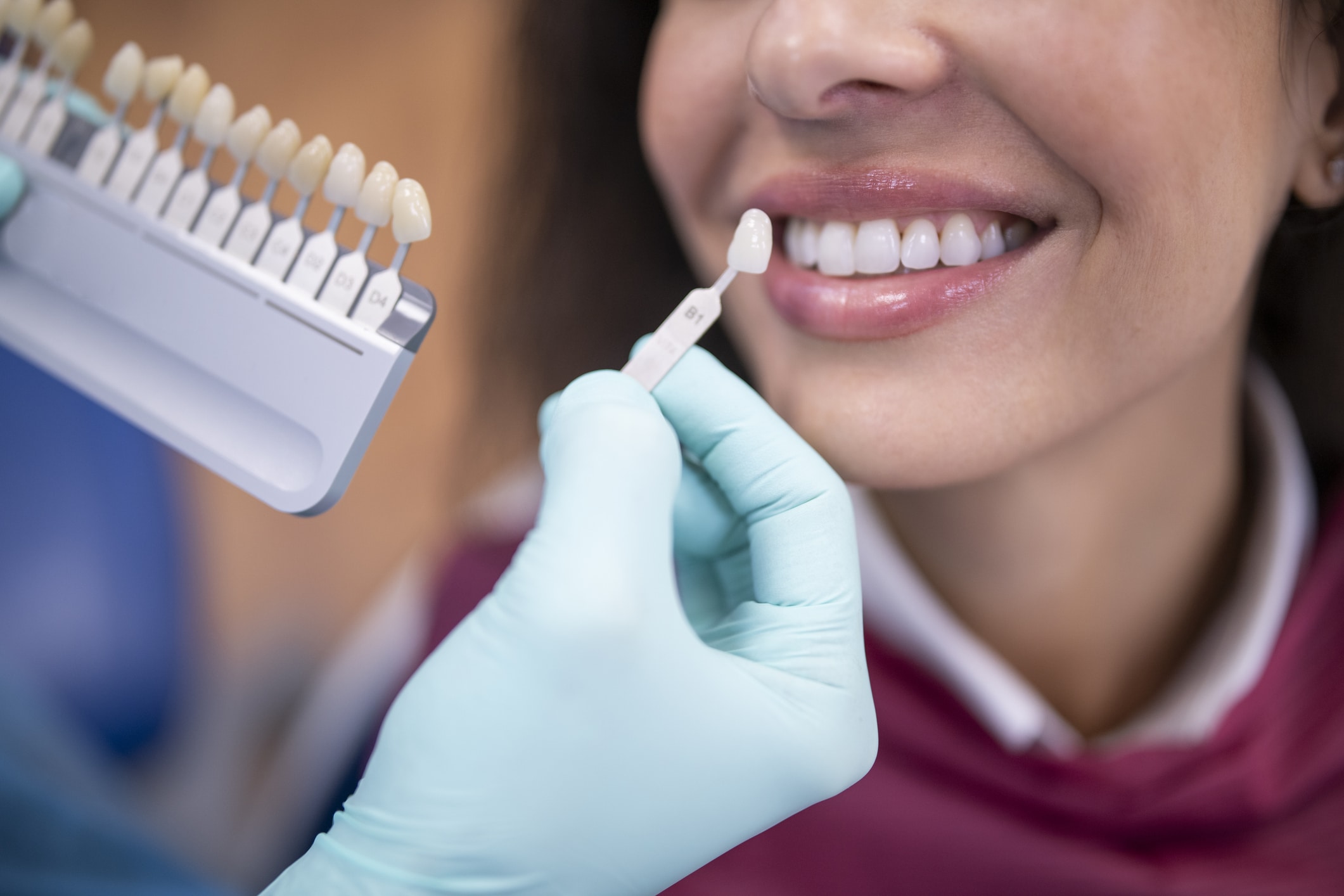 Dentist discussing dental veneers with smiling patient