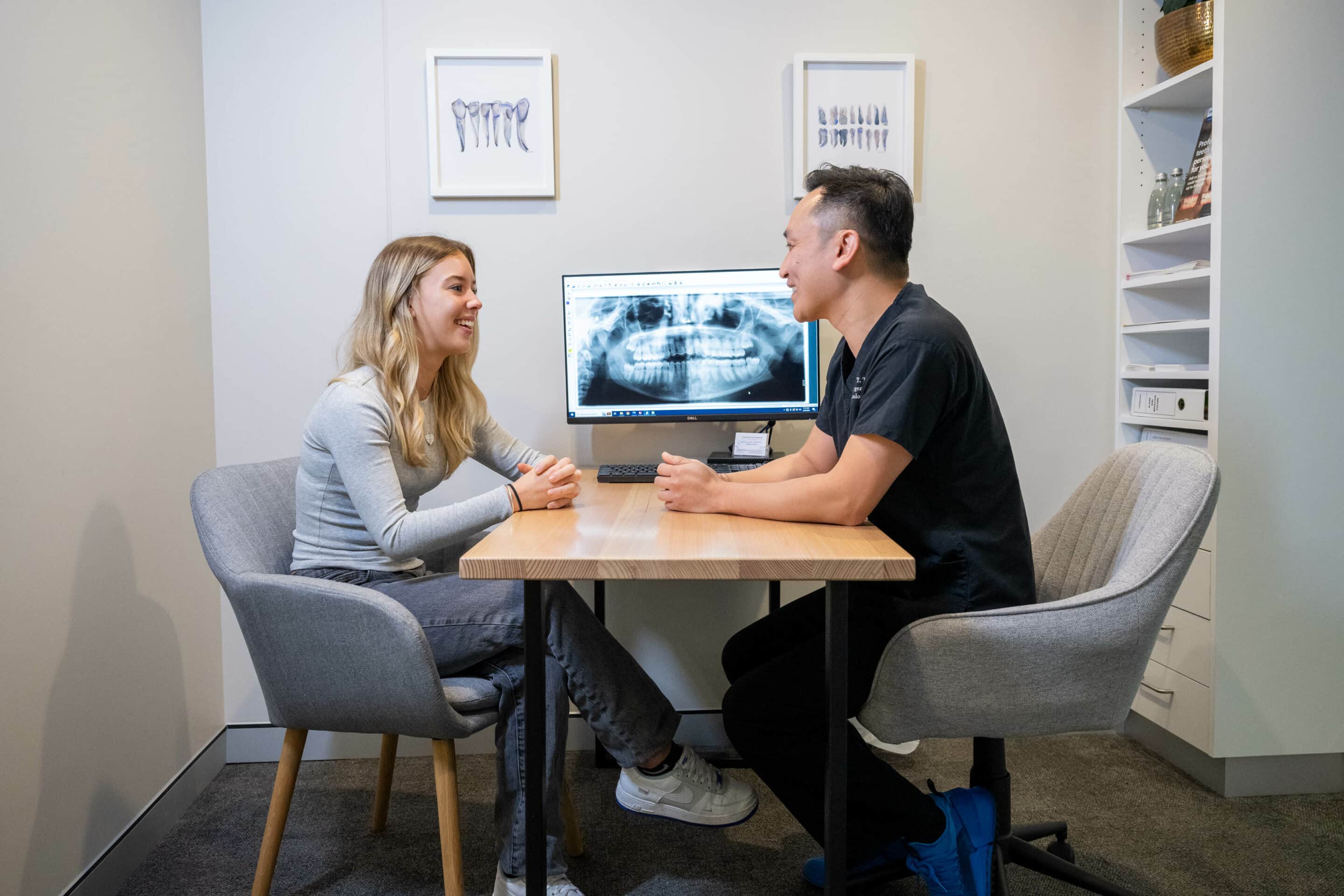 Dentist and patient discussing wisdom tooth procedure at Beaches Dental Mona Vale