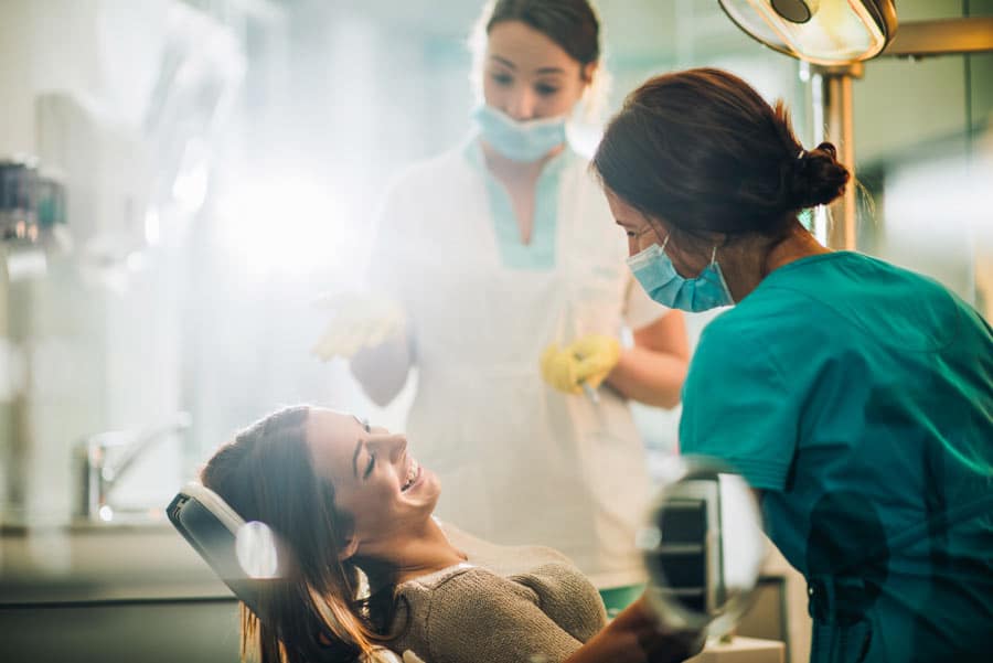 a dentist and a patient talking about gum health